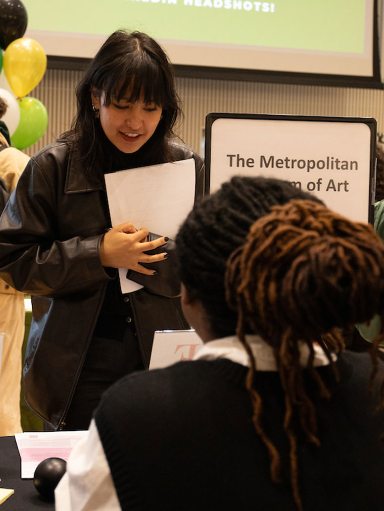 Student speaking with an employer at an internship fair