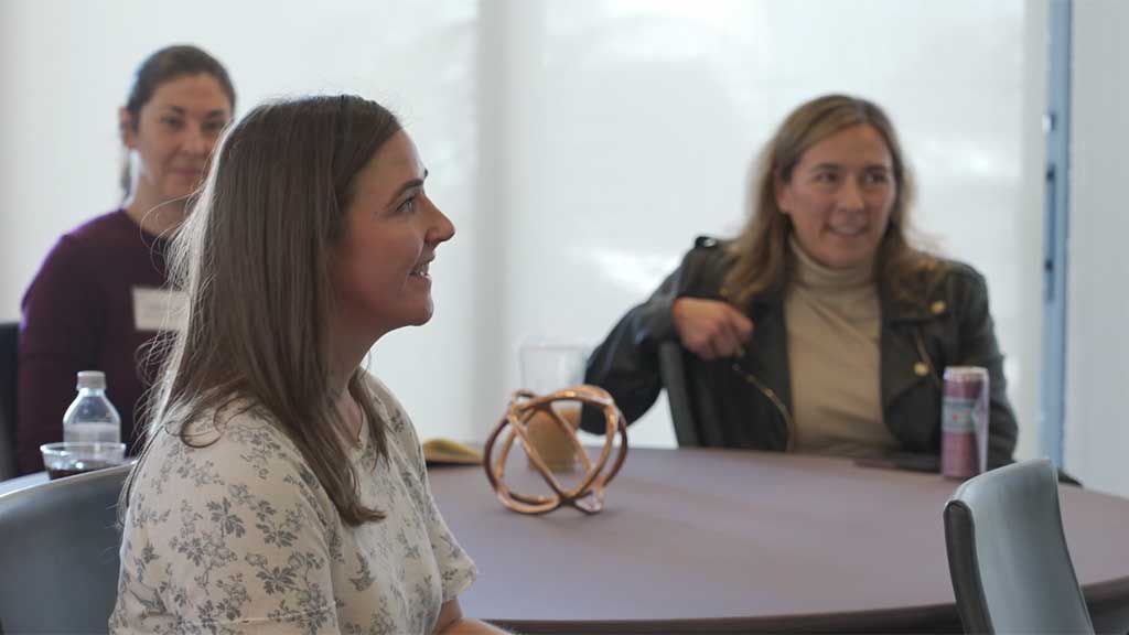 Women smiling at a table