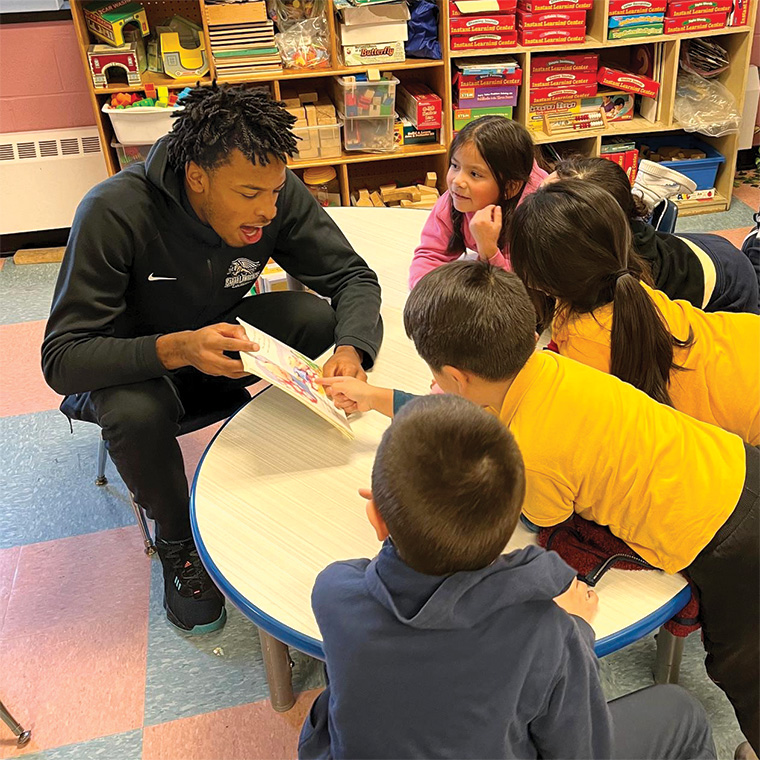 student teacher with preschool children