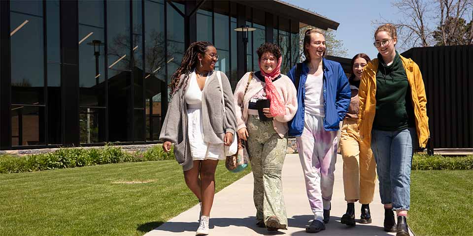 Graduate students walking together outside