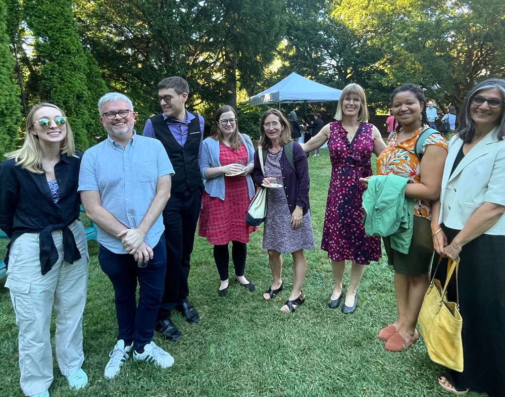 Group of faculty posing and smiling